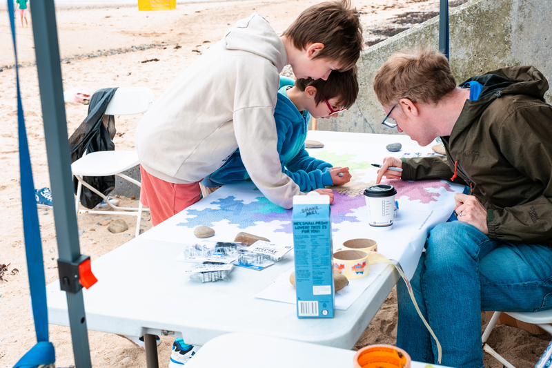 Two children signing the map.