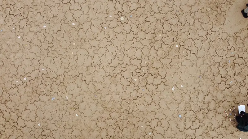 Looking down at the tiling. Marker stones are clearly visible in the middle of some of the Spectre shapes.