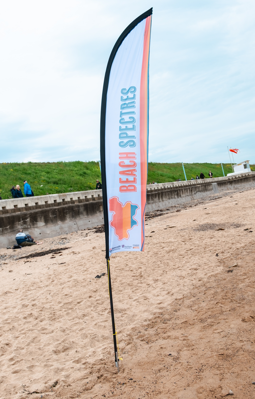 A feather banner with the Beach Spectres logo.