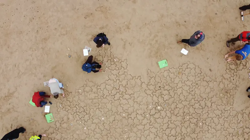 Looking down at people working on the tiling.